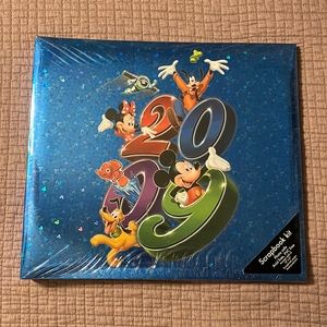 Disney official scrapbook 2009. NEW